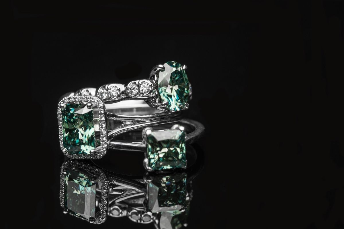 Platinum color with emerald gem