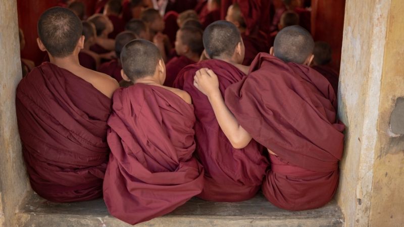 Young monks wearing maroon colored robes example - Maroon complementary colors