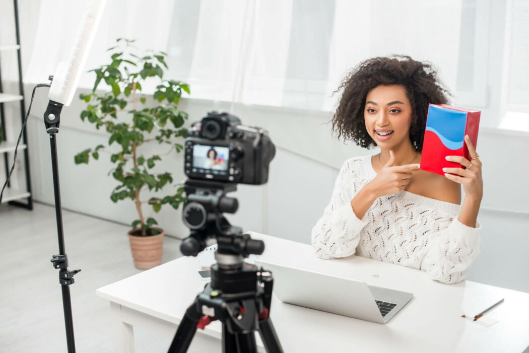 Influencer filming a video at her desk